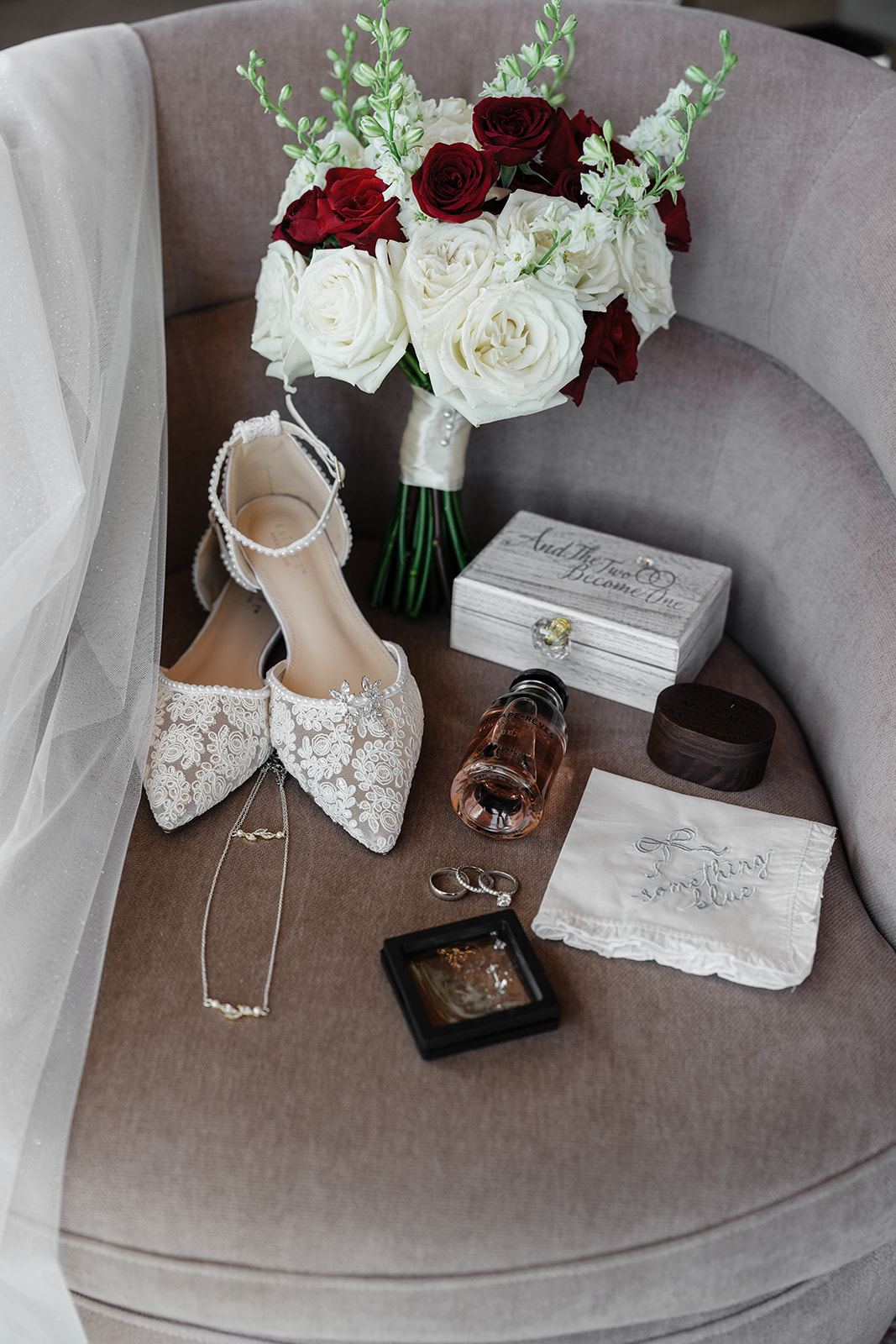 Bridal details flat lay: shoes, bouquet, and rings at Everhart Gathering Place