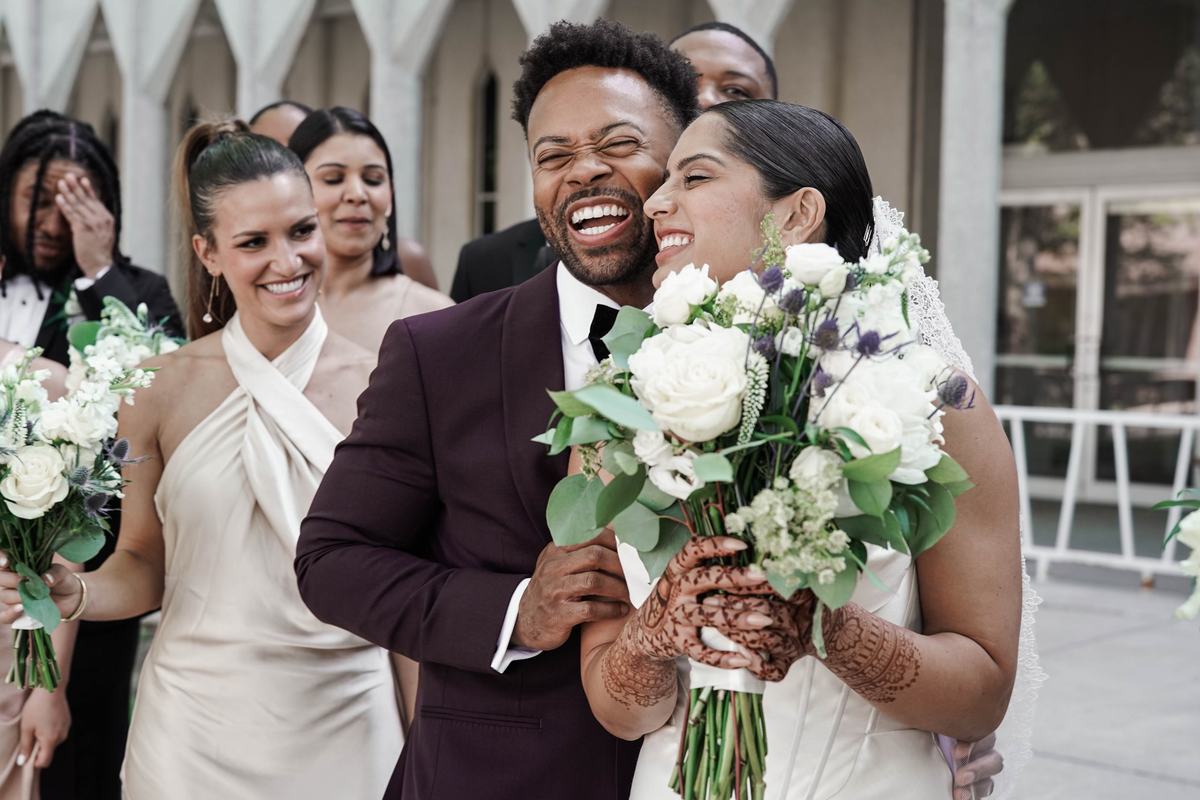 Candid laughter with the wedding party at State Savings Bank