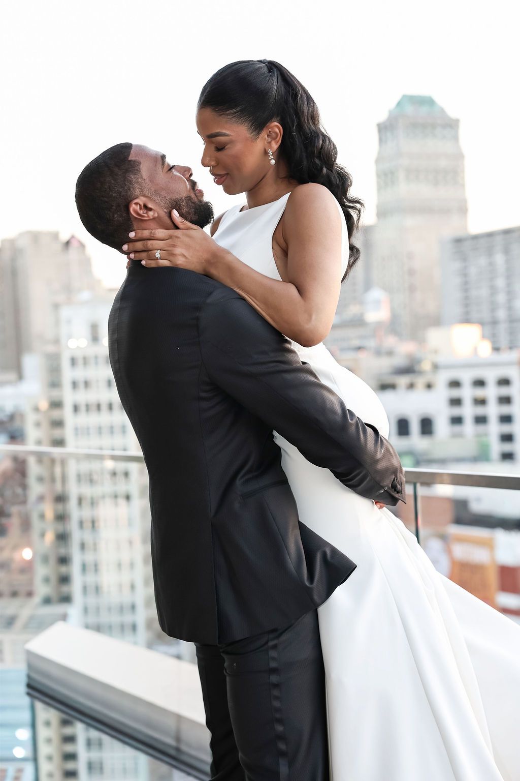 Wedding party celebration on the church steps for B and N's Detroit wedding