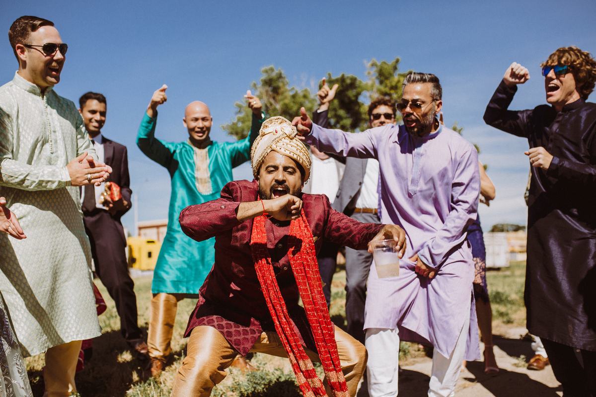 Wedding party dancing during the baraat procession in Detroit