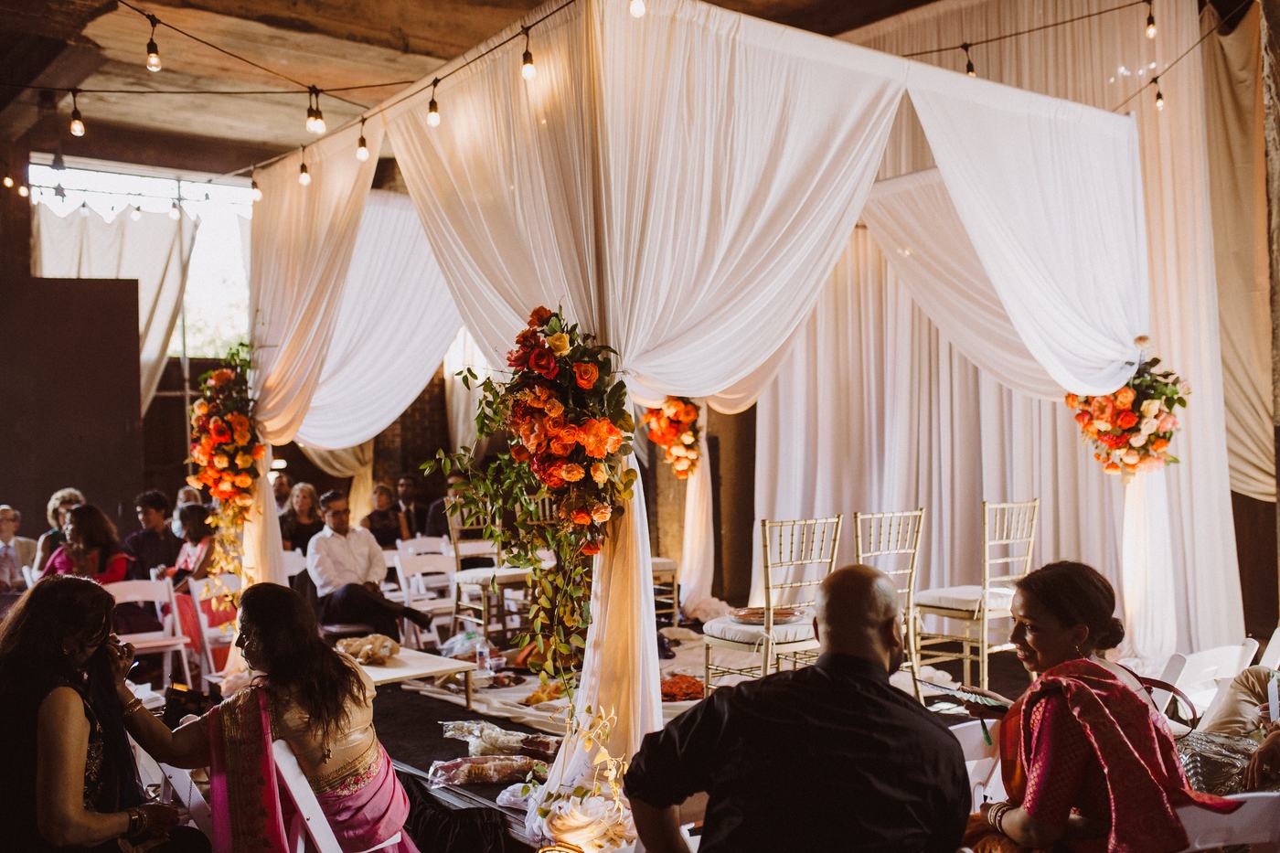 Wedding ceremony draping and floral installation at The Riverside, Detroit