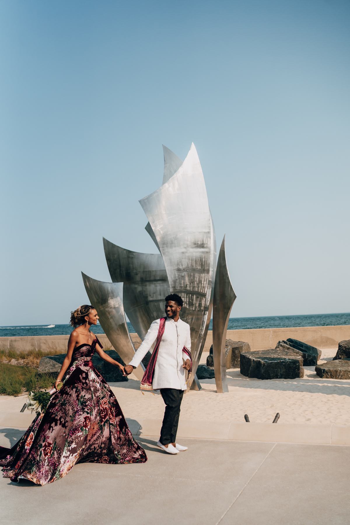 V and K walking hand in hand at The War Memorial, a Planning Exchange wedding