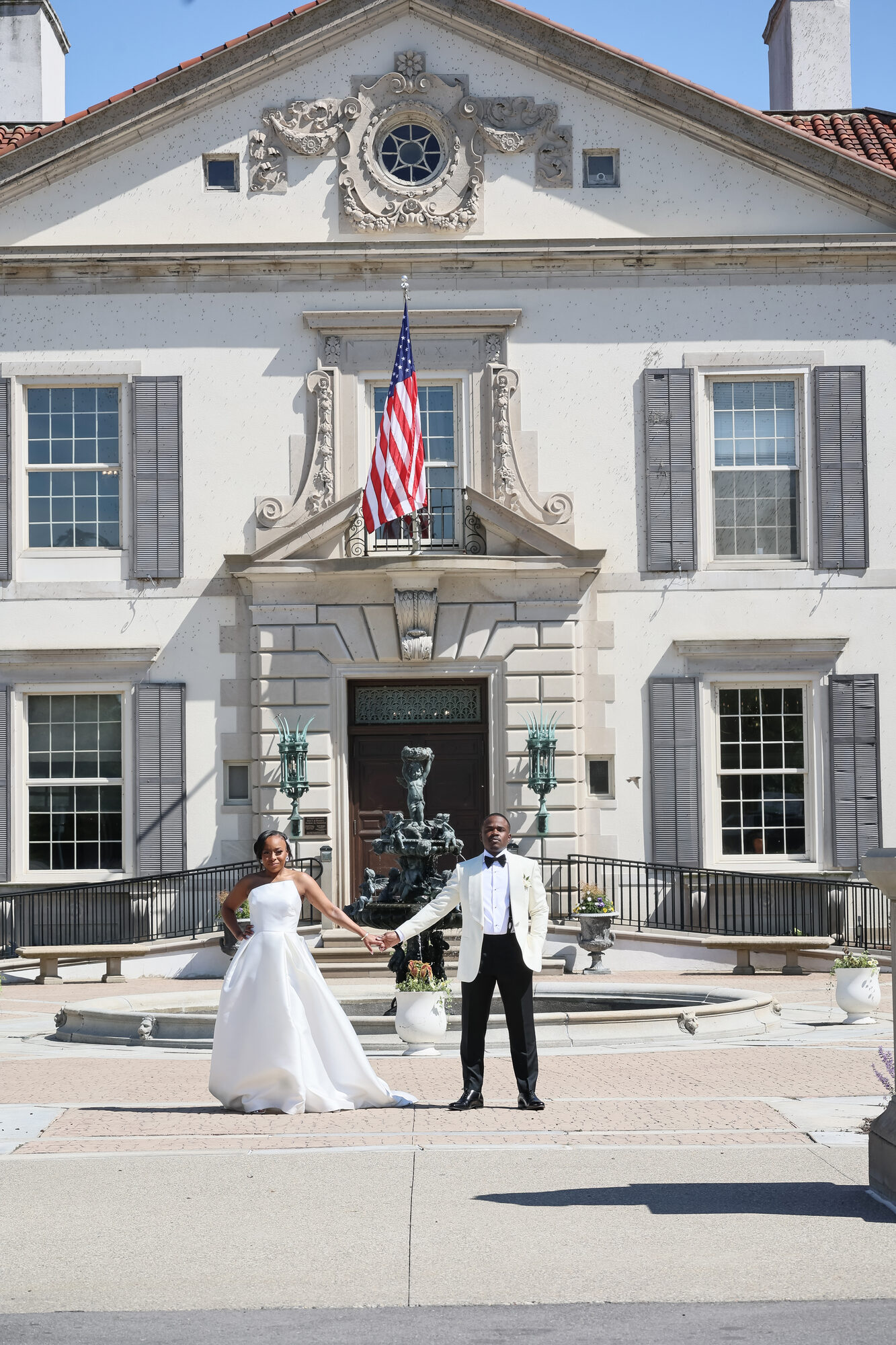 Bride and groom sharing a moment at the War Memorial fountain, Grosse Pointe Farms